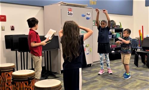 Students rehearsing moves